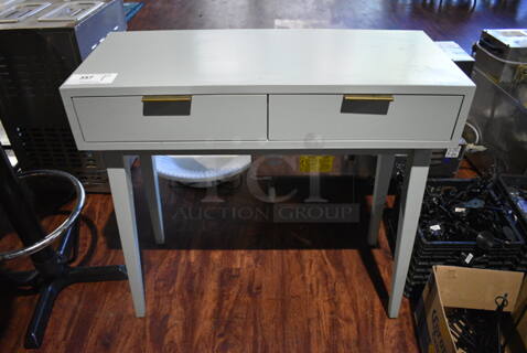Gray Desk w/ 2 Drawers. 34x14x33. (lounge)