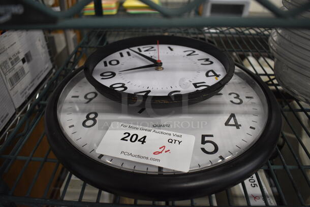 2 Various Clocks. 8.5x1.5x8.5, 13.5x2x13.5. 2 Times Your Bid!