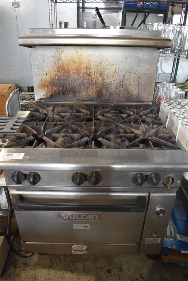 Vulcan Stainless Steel Commercial Natural Gas Powered 6 Burner Range w/ Oven, Over Shelf and Back Splash on Commercial Casters. 36x35x59