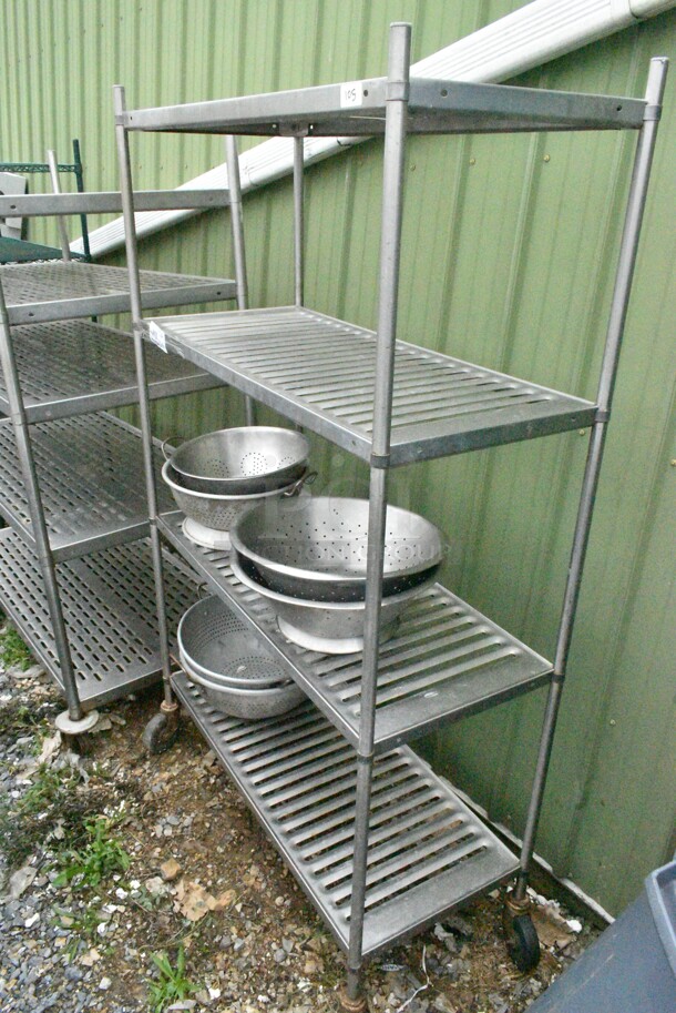 Metal 4 Tier Shelving Unit w/ Contents Including Colanders. BUYER MUST DISMANTLE. PCI CANNOT DISMANTLE FOR SHIPPING. PLEASE CONSIDER FREIGHT CHARGES.
 - Image 3 of 9