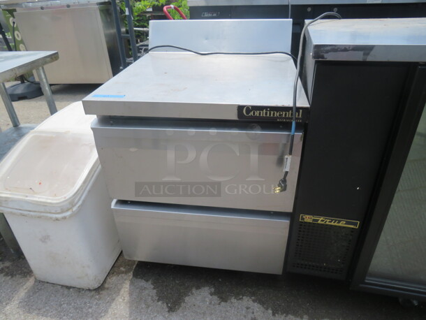 One SS 2 Drawer Continental Worktop Refrigerator On Casters.  115 Volt. Model# SW27-BS. 27.5X31X40.5 - Image 1 of 2