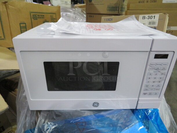 One NEW GE Microwave. 700 Watt. #JEM3072DHWW. 18X13X10