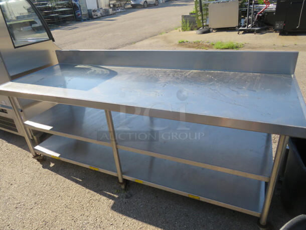 One Stainless Steel Table With 2 Stainless Steel Under Shelves With Back Splash, On Casters. 90X32X39.5 - Image 1 of 2