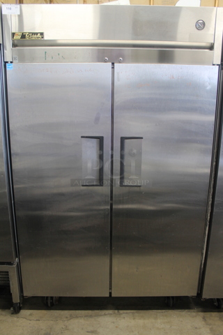 2013 True TG2R-2S ENERGY STAR Stainless Steel Commercial 2 Door Reach In Cooler w/ Poly Coated Racks on Commercial Casters. 115 Volts, 1 Phase. Tested and Working!