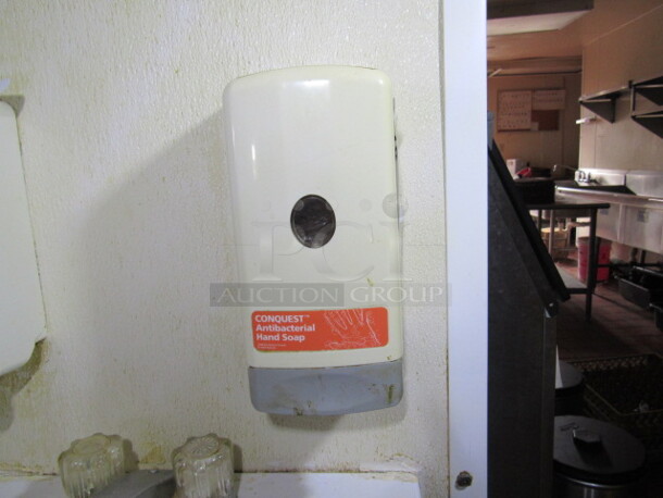 One Wall Mount Soap Dispenser. BUYER MUST REMOVE!
