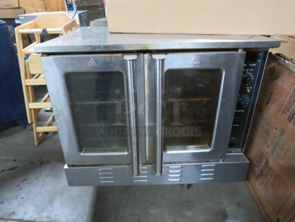 One Full Size Natural Gas Convection Oven With 4 Racks. 38X38X29.5