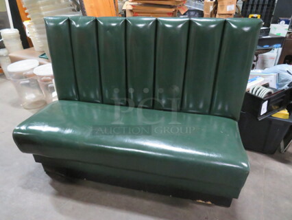 One Waiting Bench With Green Cushioned Seat And Back. 54X23X40