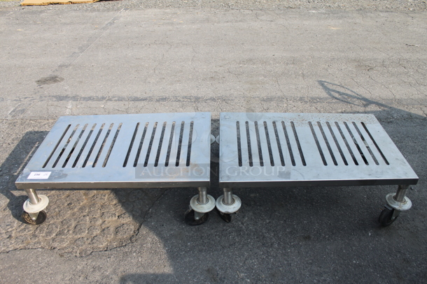2 Commercial Stainless Steel Dunnage Racks With Stainless Steel Top On Commercial Casters. 