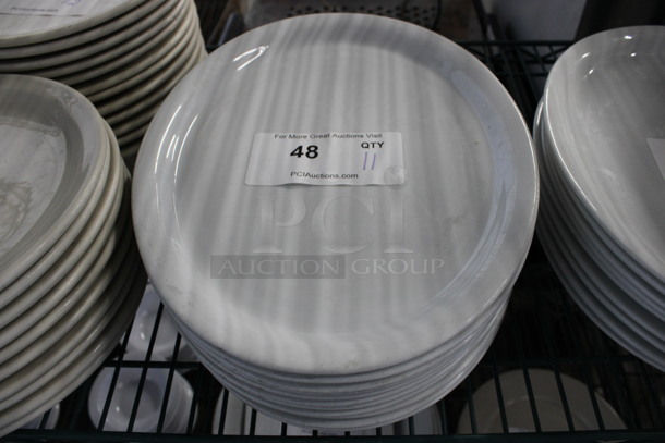 11 White Ceramic Oval Plates. 13x10x1. 11 Times Your Bid!