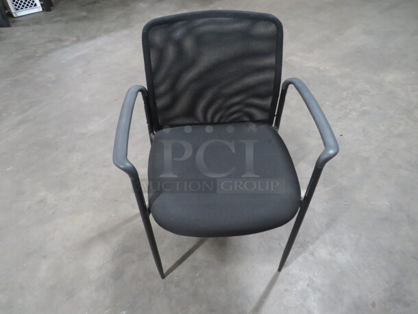 Black Arm Chair With Black Cushioned Seat, and Mesh Back. 4XBID