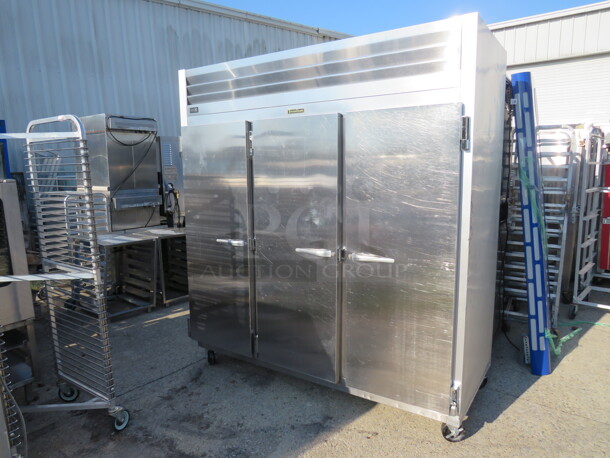 ONE AWESOME WORKING 3 Door Traulsen Refrigerator With 9 Racks On Casters. Model# G30011. 115 Volt. 76.5X34X83.5. $9175.68 - Image 1 of 3