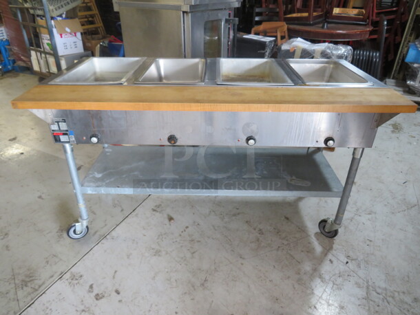 One Eagle 4 Well Steam Table With Under Shelf, Butcher Block Cutting Board, And Optional Board To Use AS A Table. Model# DHT4-240. 240 Volt. 3000 Watt. 63.5X31X39