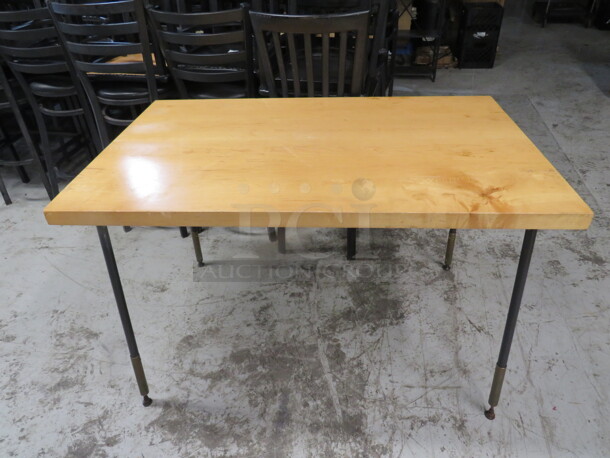One 1-3/4 Inch Thick Light Oak Table On Black Metal Legs. 48X30X31 - Image 1 of 1
