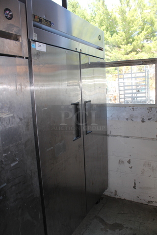 2012 True TG2R-2S ENERGY STAR Stainless Steel Commercial 2 Door Reach In Cooler w/ Poly Coated Racks on Commercial Casters. 115 Volts, 1 Phase. Tested and Working!