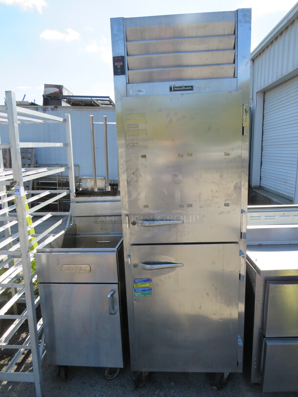 One Traulsen Dutch Door Reach In Freezer On Casters. Not Working. Electrical, Wires. Model# ALT132NUT-HHS. 115 Volt. 26.5X35X84 - Image 1 of 2