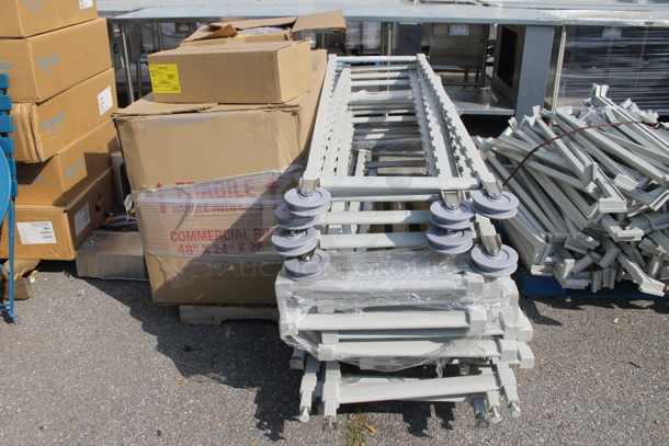 ALL ONE MONEY! PALLET LOT of BRAND NEW! Gray Poly Transport Rack Pieces, Pentair Water Filter Piece and Box - Image 1 of 9