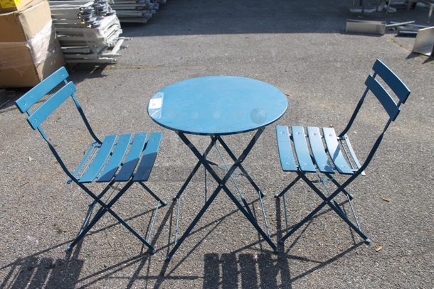 Blue Metal Round Folding Table and 2 Blue Metal Folding Chairs. 23.5x23.5x27.5, 16.5x14.5x32