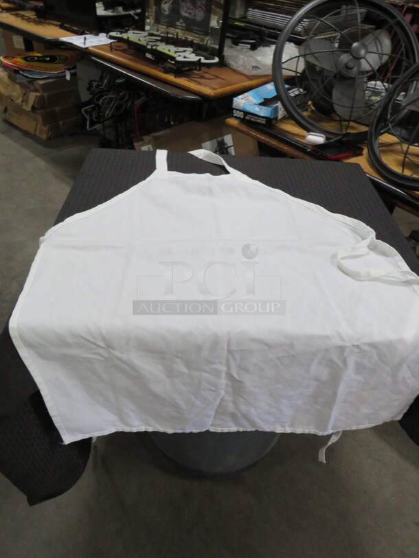 One Lot Of White Aprons. - Image 1 of 2
