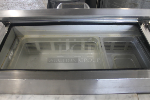 2014 Leader ESPT72SC Commercial Stainless Steel 3-Door Pizza Prep Table With Marble Style Countertop, Lift Up Lids, Plastic Drop-In Bins And Steel Racks On Commercial Casters. 115V. Tested and Powers On But Does Not Get Cold
 - Image 4 of 10