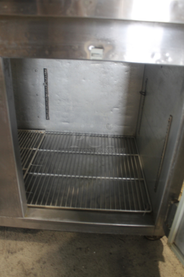 2014 Leader ESPT72SC Commercial Stainless Steel 3-Door Pizza Prep Table With Marble Style Countertop, Lift Up Lids, Plastic Drop-In Bins And Steel Racks On Commercial Casters. 115V. Tested and Powers On But Does Not Get Cold
 - Image 8 of 10