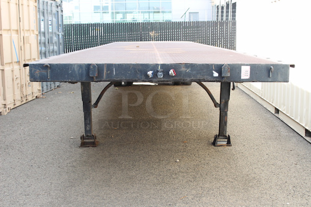 ROAD READY!! 40FT Steel Flatbed Tailer, 4 Wheels. 40FTx96".    VIN# 070F1283; Year 1970; Manufacturer Pike Trailer; Type Flatbed; Steel Construction; Length x Width 40' x 96"; Spring Ride Suspension; Location Single Fixed Axle; Tire Size LP 22.5; Wheel Construction Steel; Wheel Type Budd - Image 7 of 10