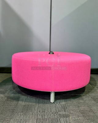 Bright pink ottoman with power source. Silver metal legs support this vibrant colored piece with 4 plugs. In great condition! 44” W x 18.5” H.  