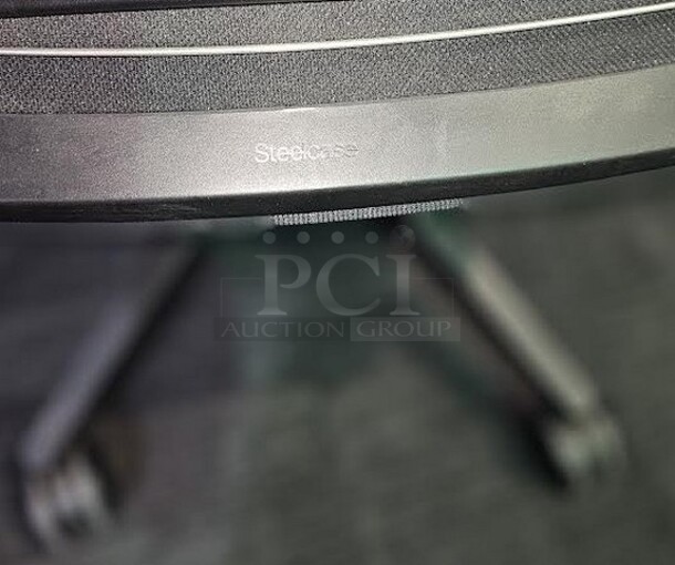 Black Steelcase office desk chair with armrests, black framing and wheels. Adjustable and in good condition! Shows normal signs of use. Measures 41” H x 26.5” W.  - Image 3 of 3