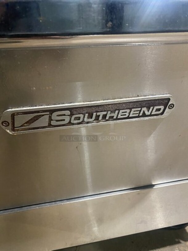 Southbend Commercial LP Powered 6 Burner Stove With Right Side Flat Griddle! Griddle Has Side Splashes! With Raised Back Splash And Salamander Shelf! With 2 Oven Underneath! Metal Oven Racks! All Stainless Steel! On Casters! - Image 9 of 11