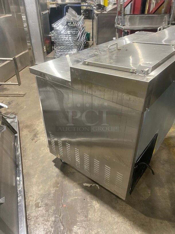 Sweet! LATE MODEL! Central Commercial Refrigerated Pizza Prep Table! With Full Length Removable Cutting Board! With 2 Door Refrigerated Storage Underneath! With Poly Coated Racks! 115V 1 Phase! Model: 69K014 SN: 8060492! On Commercial Casters! Working When Removed!  - Image 5 of 12
