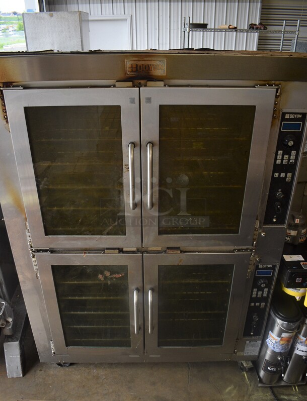 2014 Doyon Model JA20 Stainless Steel Commercial Double Deck Electric Powered Bakery Convection Oven w/ View Through Doors and Metal Oven Racks on Commercial Casters. 208 Volts, 3 Phase. 53x49x73
