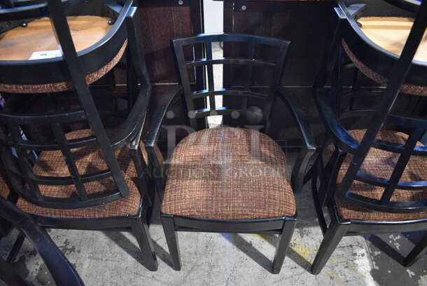 4 Black Wood Pattern Dining Chairs w/ Patterned Seat Cushion and Arm Rests. 20x18x33. 4 Times Your Bid!