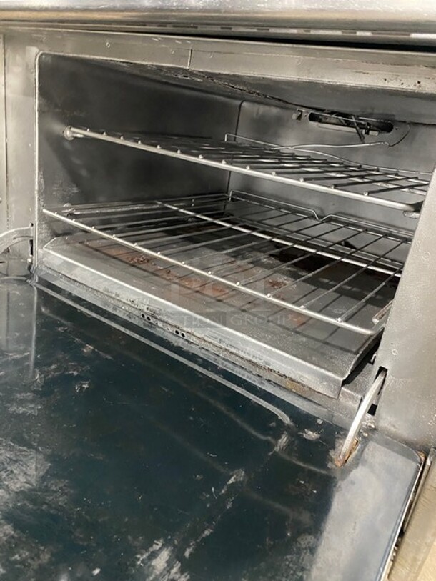 GREAT! Southbend Commercial Natural Gas Powered 6 Burner Stove! With full Sized Oven Underneath! With Backsplash & Overhead Salamander Shelf! All Stainless Steel! With Metal Oven Racks! On Legs! Model: 4361D SN: 11A17770! - Image 7 of 10