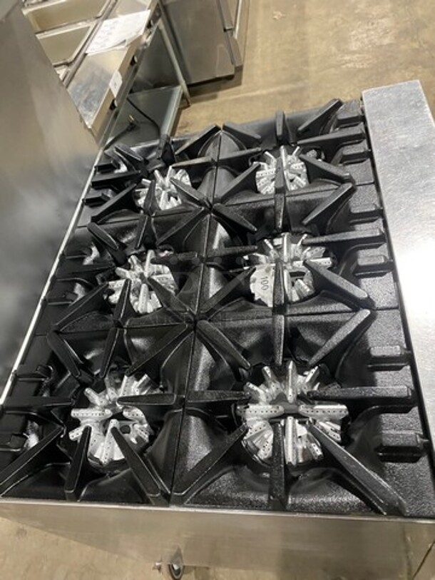 Garland Commercial Natural Gas Powered 6 Burner Stove! With Raised Back Splash And Salamander Shelf! With Oven Underneath! Metal Oven Rack! All Stainless Steel! On Casters! - Image 5 of 10
