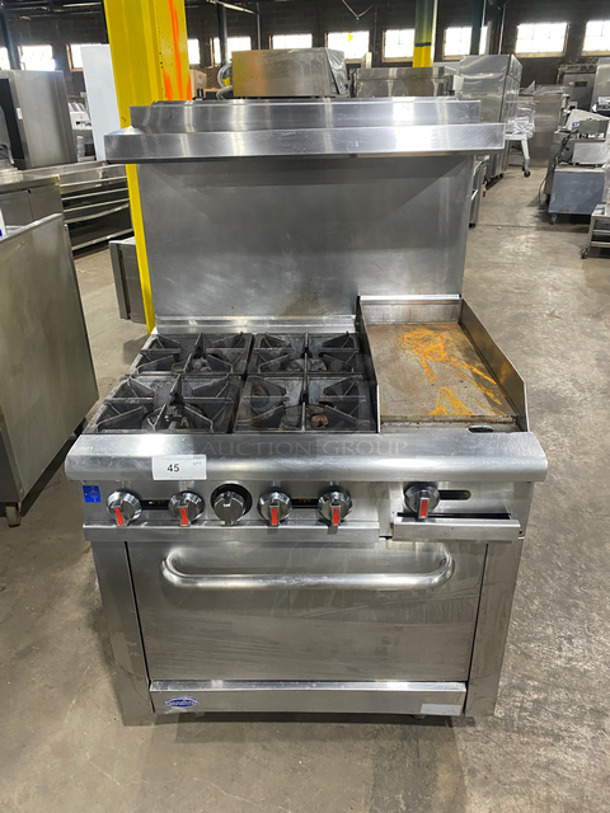 Zanduco Commercial Gas Powered 4 Burner Stove With Built In Flat Grill! Flat Grill Has Side Splashes! With Raised Back Splash And Salamander Shelf! With Oven Underneath! Metal Oven Racks! All Stainless Steel! On Legs!