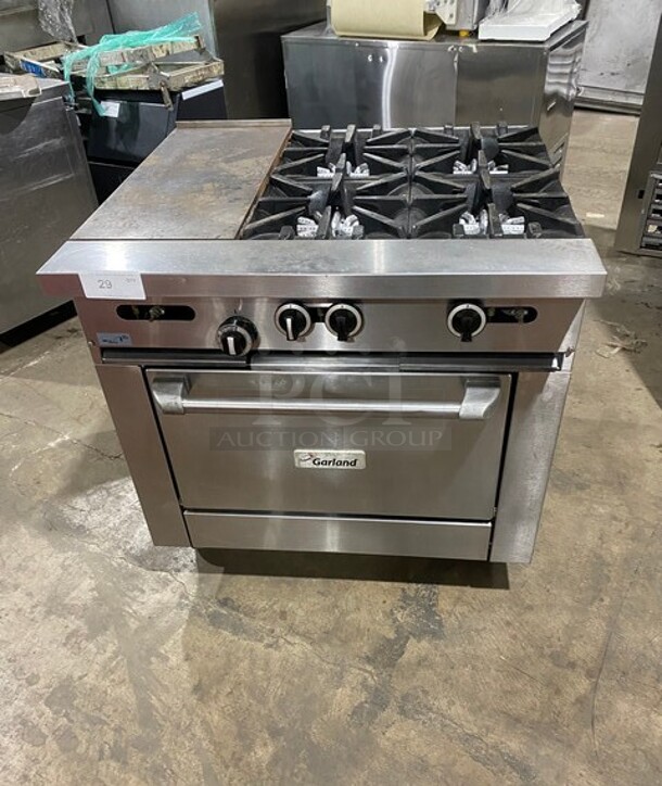 Garland Commercial Natural Gas Powered 4 Burner Stove With Hot Plate! with Oven Underneath! All Stainless Steel! On Casters! - Image 1 of 11