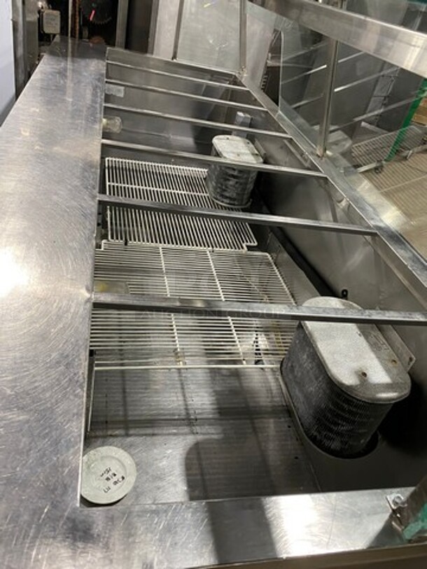 ALL STAINLESS-STEEL  96 Inch Refrigerated Sandwich Prep Table! With Sneeze Guard! With 3 Door Under Refrigeration! Sandwich Prep Area w/ 7 Compartments! 115V 1 Phase! On Casters!
 - Image 5 of 7