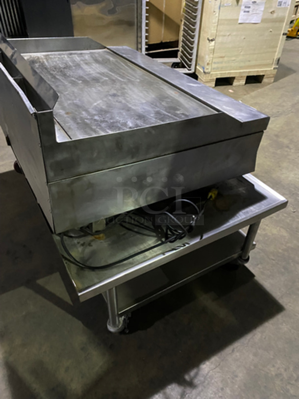 MUST HAVE! Garland Commercial Countertop Natural Gas Powered Heavy Duty Plancha Flat Grill! With Back And Side Splashes! On Heavy-Duty Stainless-Steel Equipment Stand! With Underneath Storage Space! On Casters! - Image 4 of 10