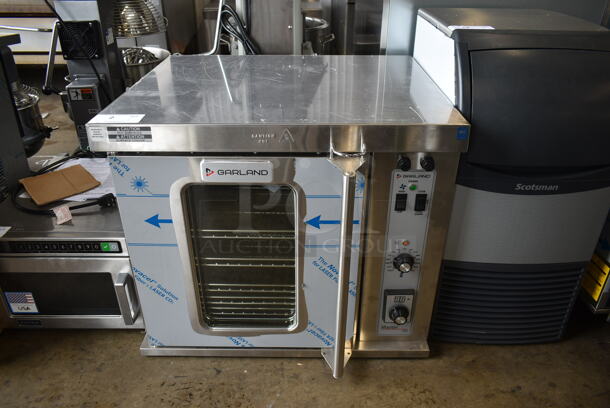 BRAND NEW SCRATCH AND DENT! 2022 Garland MCO-E-5-C Stainless Steel Commercial Electric Powered Half Size Convection Oven w/ View Through Door, Metal Oven Racks and Thermostatic Controls. 208 Volts, 3 Phase.  - Image 1 of 7