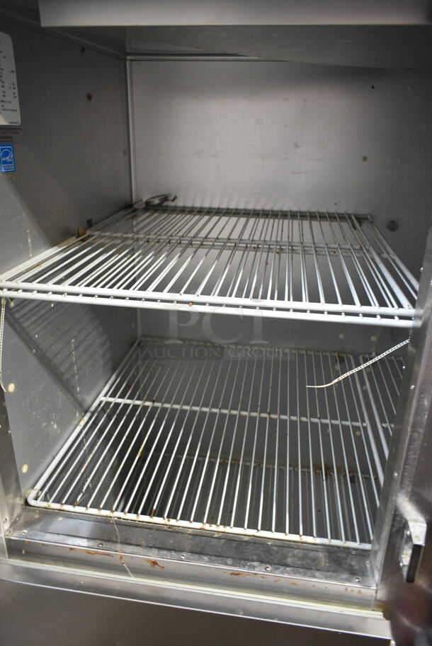 Traulsen G20000 Stainless Steel Commercial 4 Half Size Door Reach In Cooler w/ Poly Coated Racks. 115 Volts, 1 Phase. Tested and Powers On But Does Not Get Cold 
 - Image 2 of 7