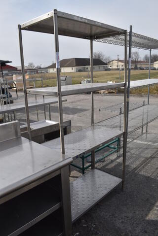 Metal 4 Tier Shelving Unit. BUYER MUST DISMANTLE. PCI CANNOT DISMANTLE FOR SHIPPING. PLEASE CONSIDER FREIGHT CHARGES. 36x19x72