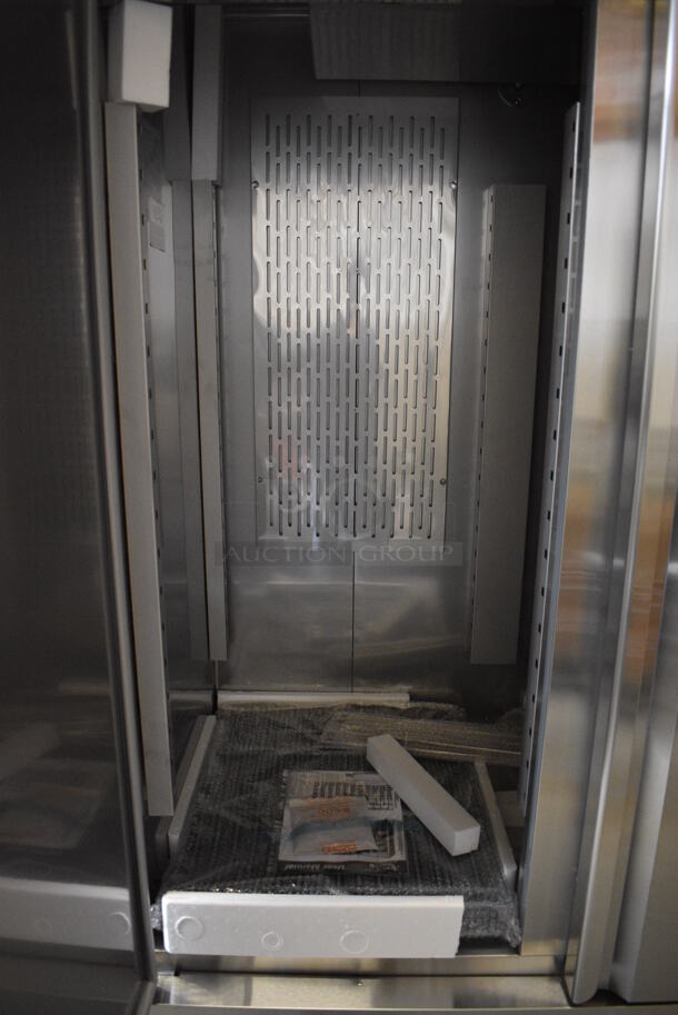 BRAND NEW SCRATCH AND DENT! Avantco Model 178SS2FHC Stainless Steel Commercial Two Door Reach In Freezer w/ Poly Coated Racks on Commercial Casters. 115 Volts, 1 Phase. 54x32x77.5. Tested and Working! - Image 5 of 7