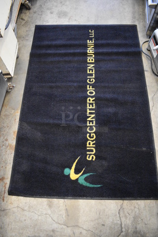 Black Floor Rug w/ Surgcenter of Glen Burnie Logo. 68x43