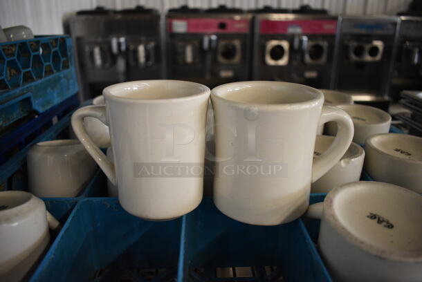 20 White Ceramic Mugs in Dish Caddy. 4.5x3x4, 4.5x3.5x4. 20 Times Your Bid!