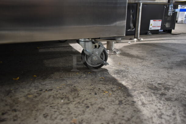 BRAND NEW SCRATCH AND DENT! 2022 Delfield GAHPT2-S Stainless Steel Commercial 2 Door Reach In Pass Through Warmer w/ Poly Coated Racks on Commercial Casters. 115 Volts, 1 Phase.  - Image 4 of 9