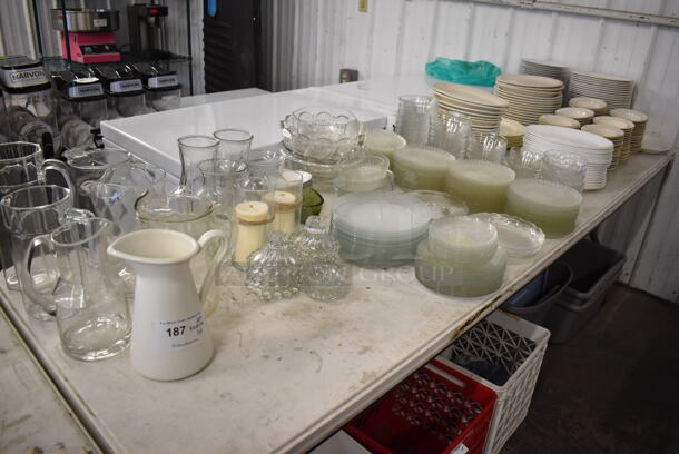 ALL ONE MONEY! Lot of Items on Tabletop Including Glass Plates, Ceramic Plates and Pitchers - Image 1 of 9