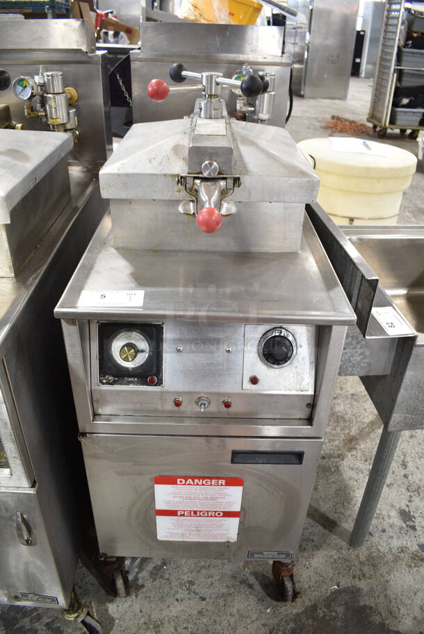 Henny Penny 600RB Stainless Steel Commercial Floor Style Natural Gas Powered Pressure Fryer w/ Metal Fry Basket on Commercial Casters. 80,000 BTU.  - Image 1 of 10