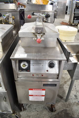 Henny Penny 600RB Stainless Steel Commercial Floor Style Natural Gas Powered Pressure Fryer w/ Metal Fry Basket on Commercial Casters. 80,000 BTU. 
