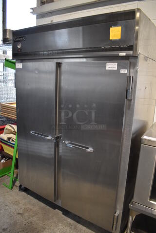Continental 2RE Stainless Steel Commercial 2 Door Reach In Cooler on Commercial Casters. 115 Volts, 1 Phase. 54x36x82. Tested and Powers On But Does Not Get Cold
