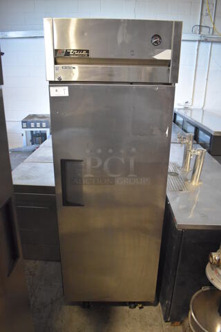2011 True TG1R-1S Stainless Steel Commercial Single Door Reach In Cooler w/ Poly Coated Racks on Commercial Casters. 115 Volts, 1 Phase. 29x35x83. Tested and Working!