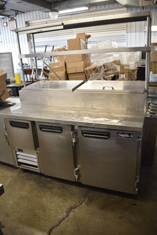 Leader Stainless Steel Commercial Pizza Prep Table w/ 2 Tier Over Shelf on Commercial Casters. 115 Volts, 1 Phase. Tested and Powers On But Does Not Get Cold